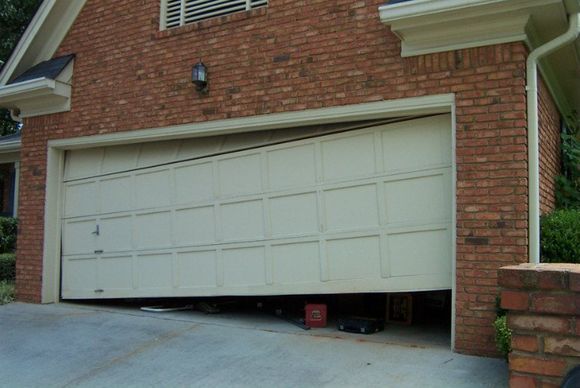 The image depicts about an open garage door with a broken panel. Get your garage door fixed with our garage door repair services near me.